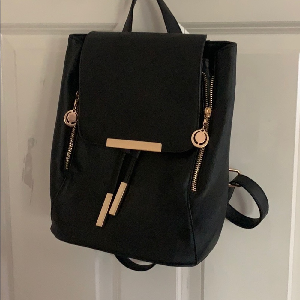 black and gold leather backpack